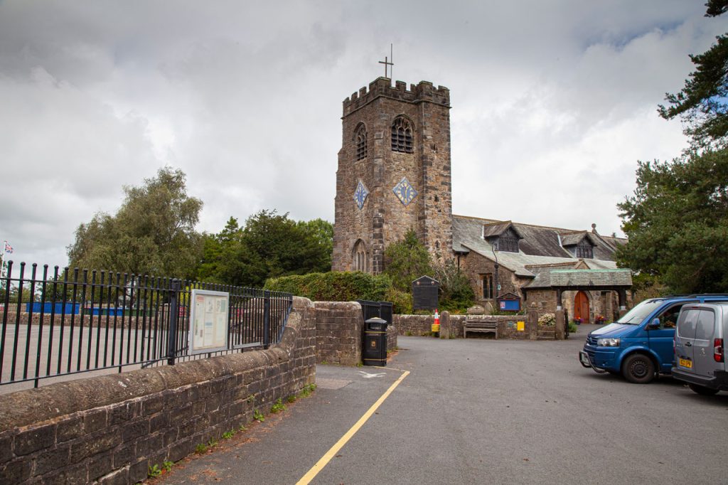 at the end of the road, a church with diamond shaped clock